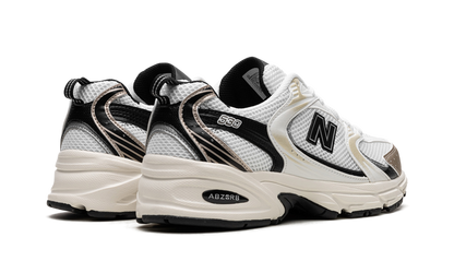 New Balance 530 Nero Bianco Oro